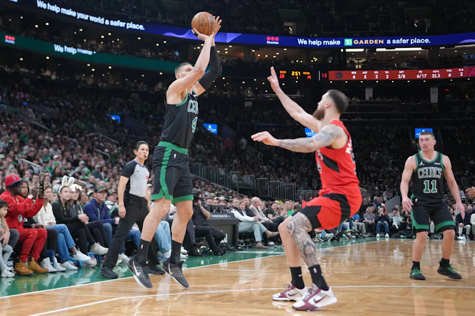 Apr 5, 2026; Boston, Massachusetts, USA; Boston Celtics center Nikola Vucevic (4) shoots a jump shot against the Toronto Raptors during the first half at TD Garden. Mandatory Credit: Gregory Fisher-Imagn Images
