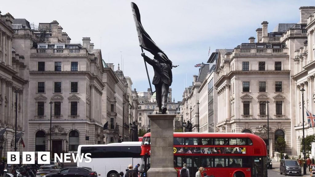 Statue with Banksy's signature appears in London - BBC
