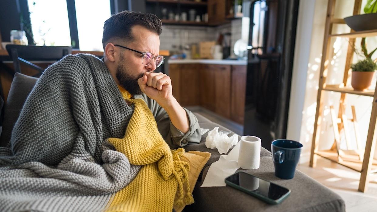 Man coughing with tuberculosis symptoms