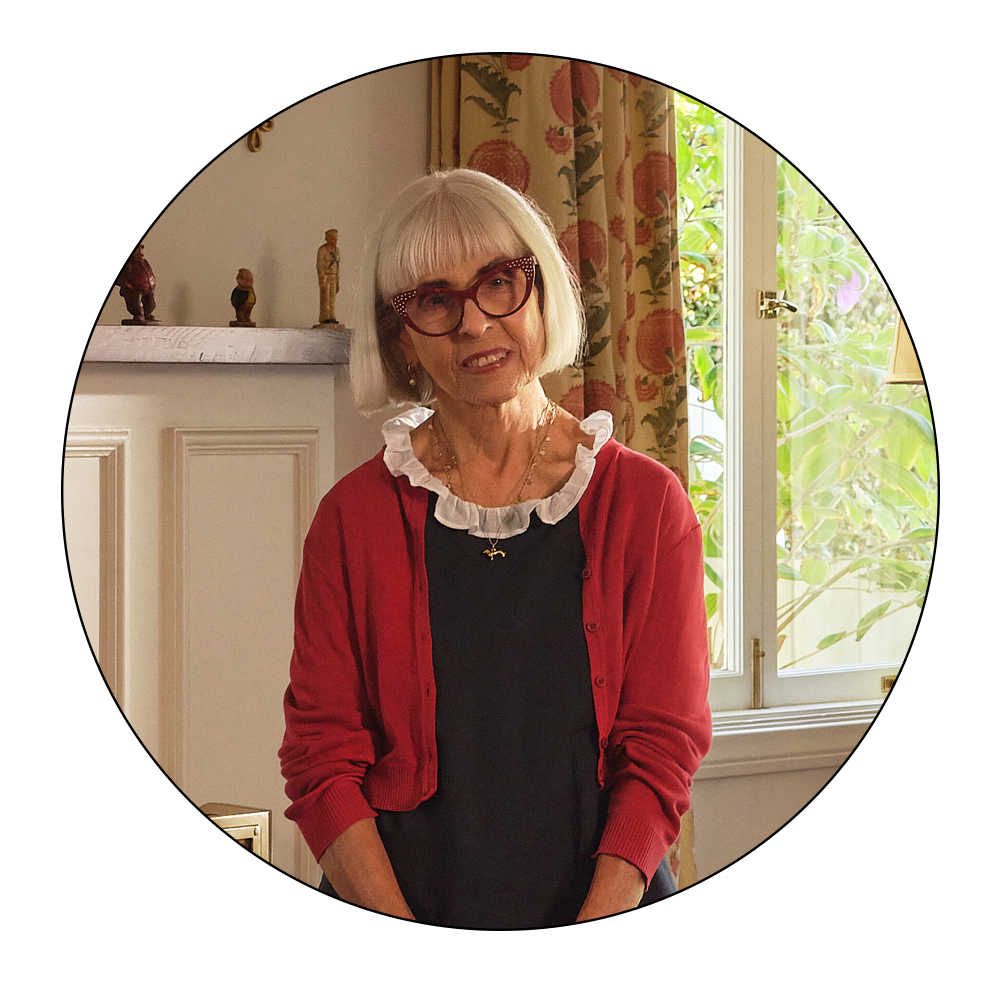 Portrait of a woman in a domestic setting.