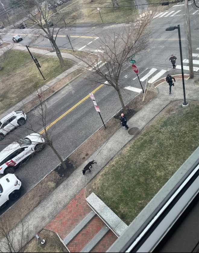 This photo taken by a Bates College student shows police on the school's campus in Lewiston, Maine, as they searched for an armed man in the area on April 16, 2026. The armed man's presence prompted a shelter-in-place at Bates College.