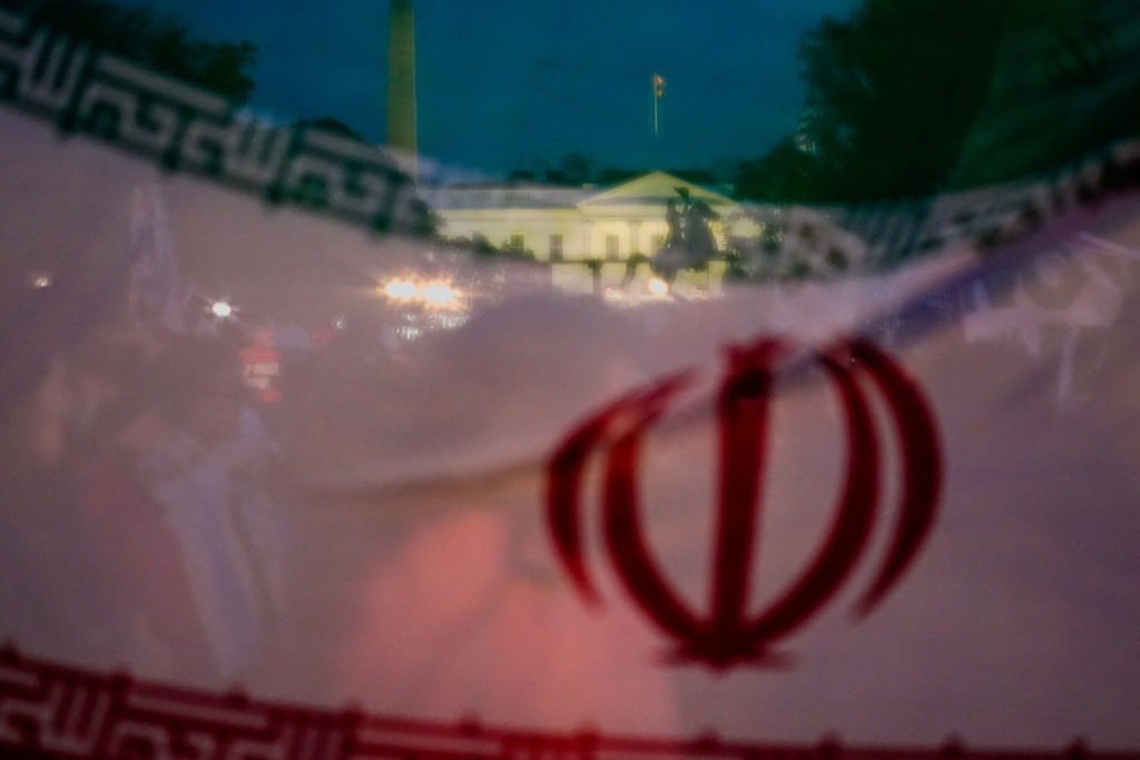 Demonstrators protest against military action in Iran after U.S. President Donald Trump said that he had agreed to a two-w...