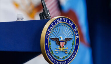 A seal for the Department of War on the podium at the Pentagon