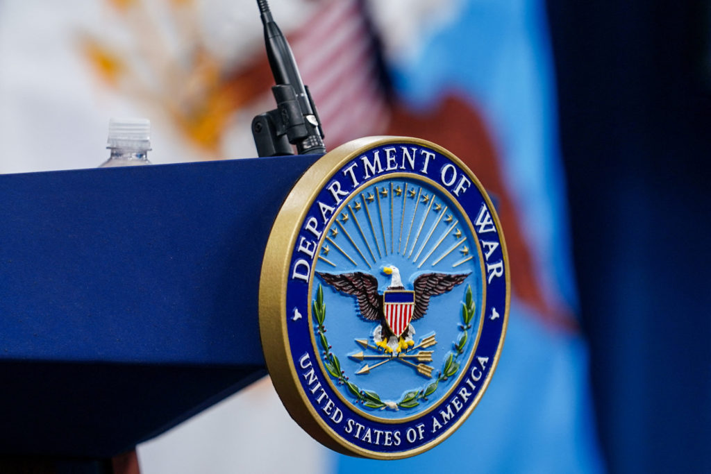 A seal for the Department of War on the podium at the Pentagon