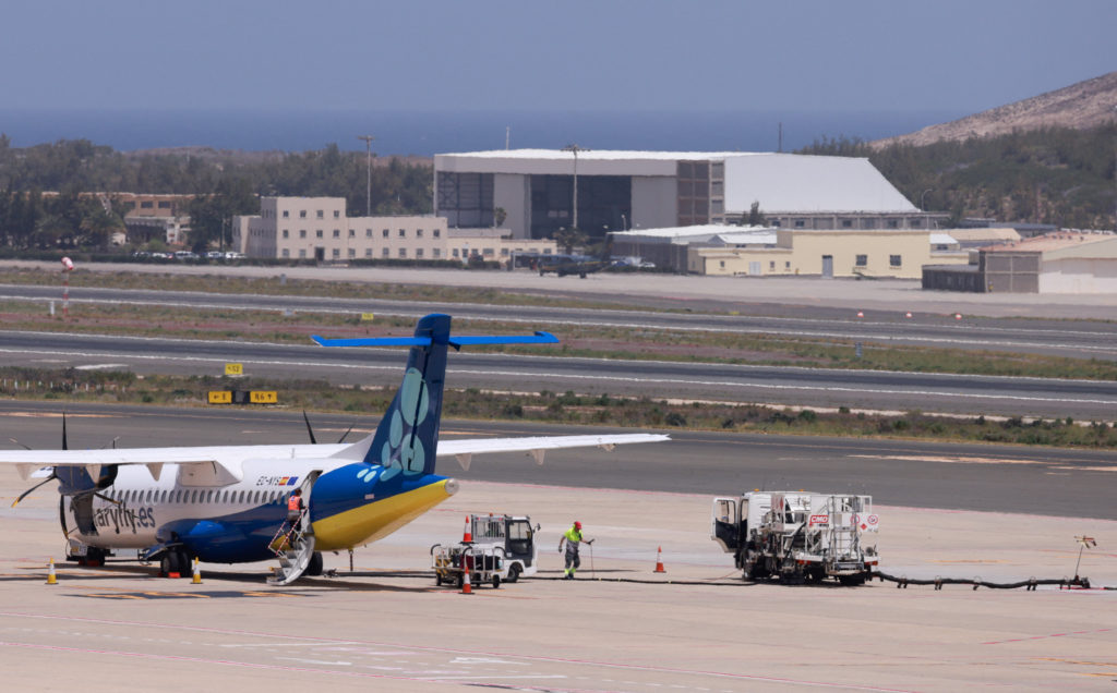 A worker refuels a Canaryfly airline plane at Gran Canaria airport, in Ingenio.