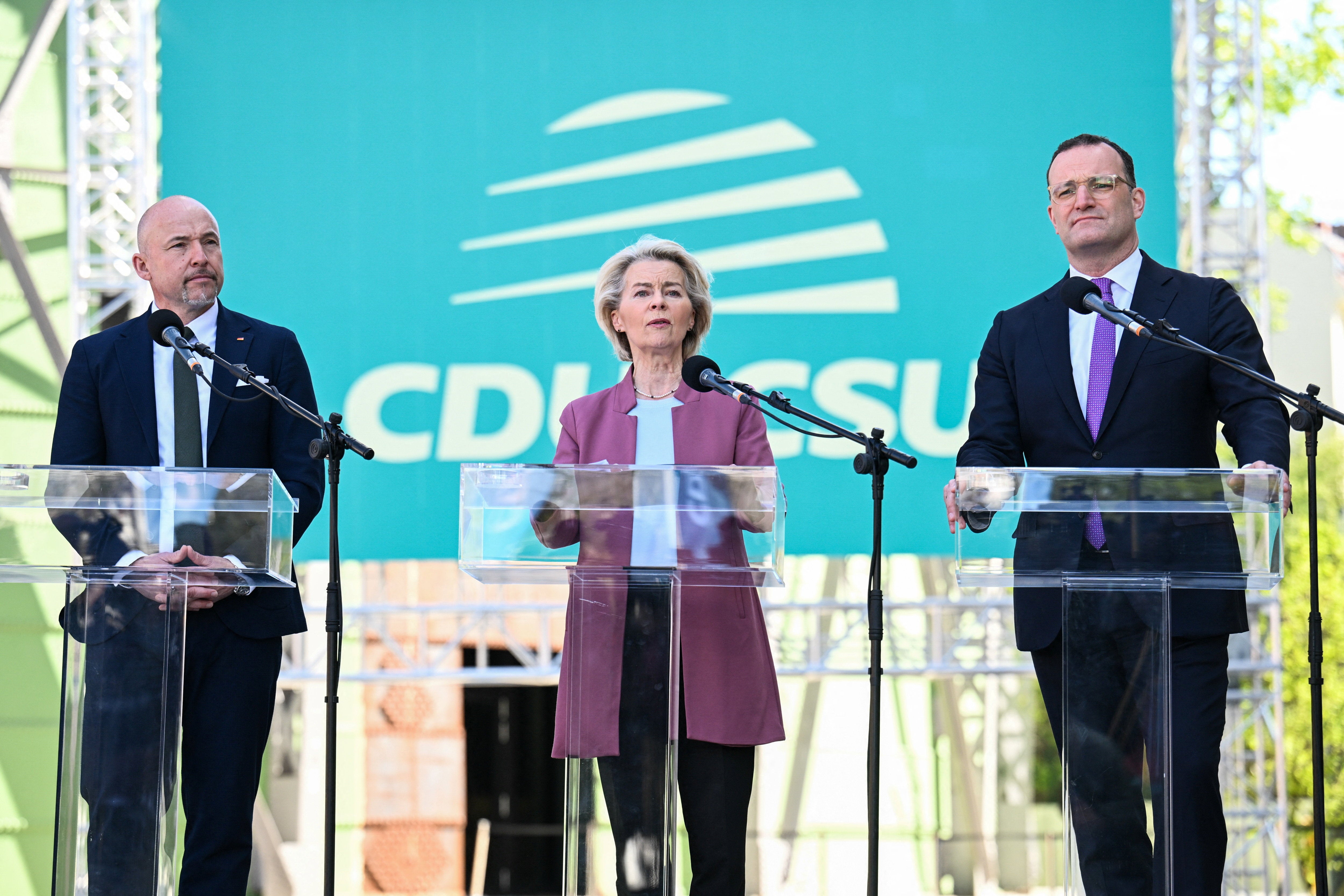 President of the European Commission Ursula von der Leyen speaks next to Chairman of the CDU/CSU parliamentary group Jens Spahn and Parliamentary group leader of the CSU Alexander Hoffmann