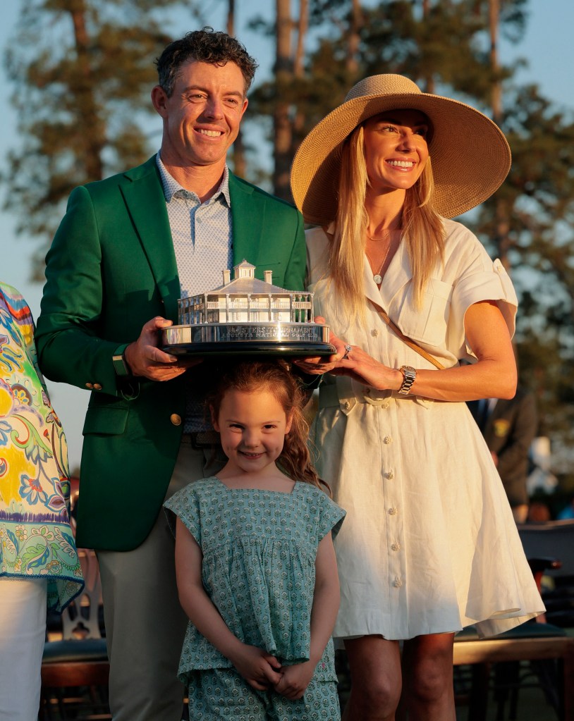 Rory McIlroy poses with wife Erica Stoll and daughter Poppy after winning The Masters on April 12, 2026.