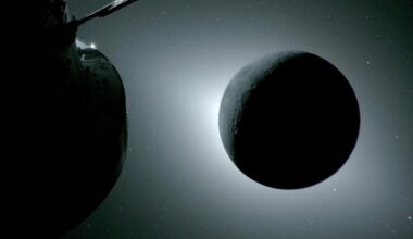 The moon, backlit by the Sun, is seen on April 6 from a camera mounted on the Orion spacecraft’s solar array wing, with part of Orion visible at left. Earthlight faintly illuminates the Moon’s left edge, making it slightly brighter than the rest of the disk.