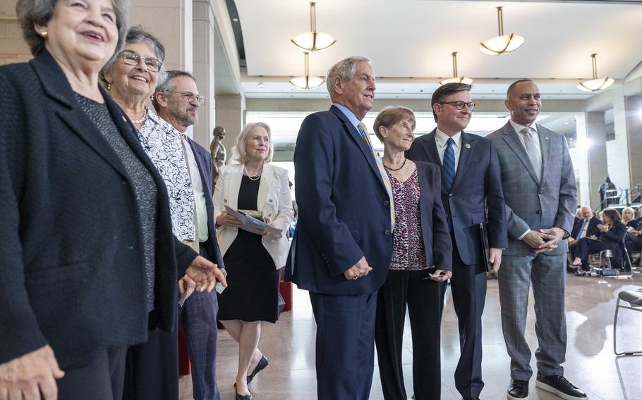 Keri Levine Ferencz, third from right, daughter of Benjamin Ferencz, stands with Rep. Joe Wilson, R-S.C.; Speaker of the House Mike Johnson, R-La.; and House Minority Leader Rep. Hakeem Jeffries, D-N.Y., during the United States Holocaust Memorial Museum’s National Commemoration of the Days of Remembrance on Tuesday, April 14, 2026, at the U.S. Capitol in Washington.