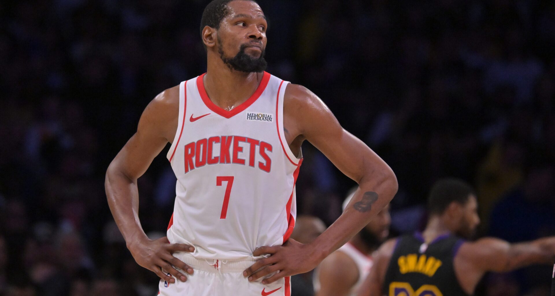 Kevin Durant on the court with his hands on his hips.