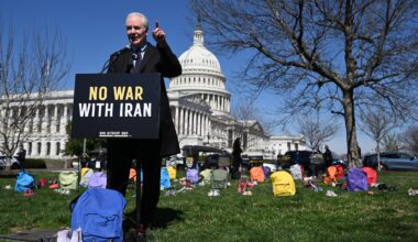 Sen. Chris Van Hollen (D-Maryland) speaks in front of a memorial made up of shoes and backpacks symbolizing those killed in the bombing of the Minab elementary school and other civilians killed in Iran sits outside the United States Capitol on March 18, 2026 in Washington, D.C.