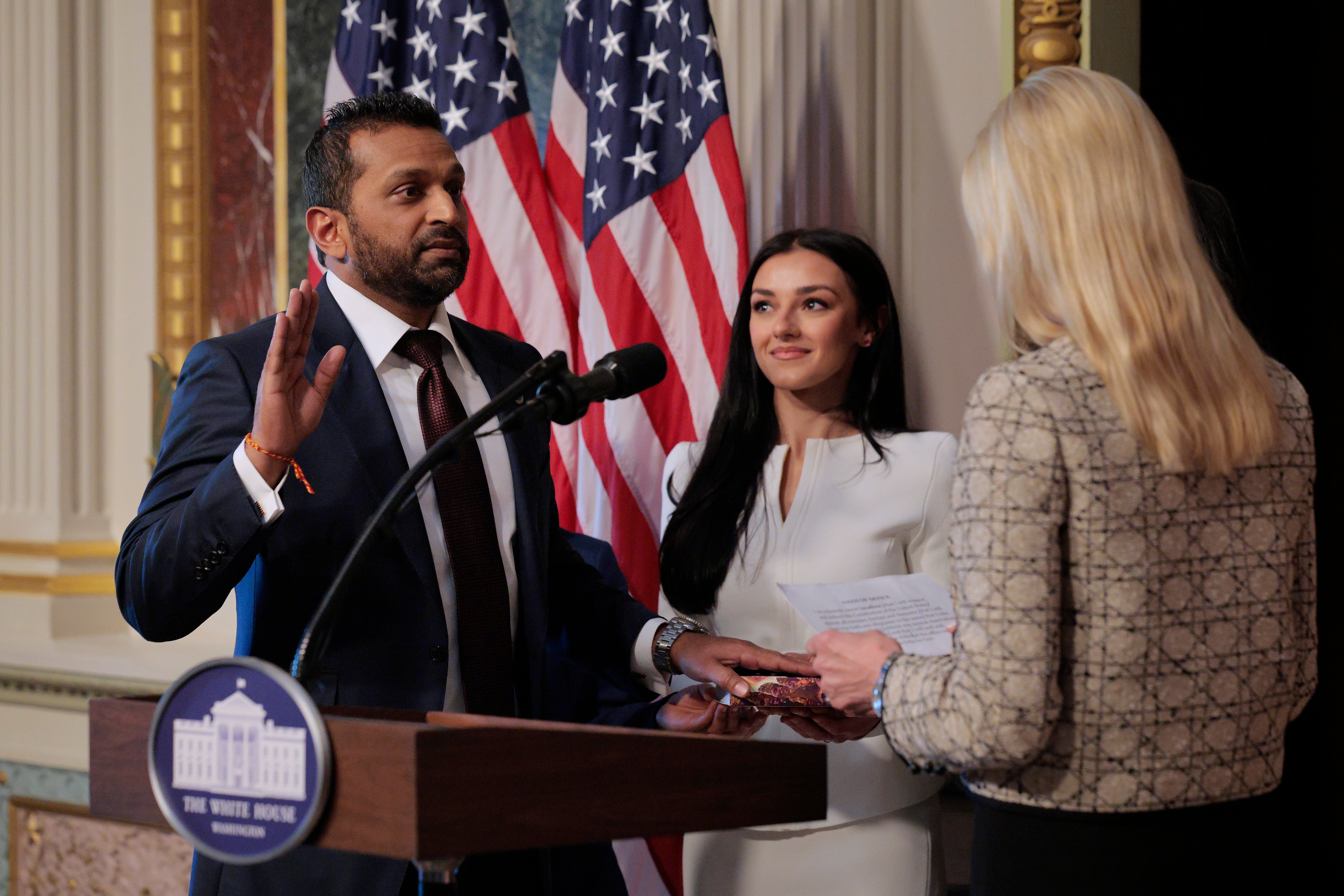 The real-life Patel at his swearing-in alongside his girlfriend, country music singer Alexis Wilkins. His visits with her have become fodder for attacks by his critics
