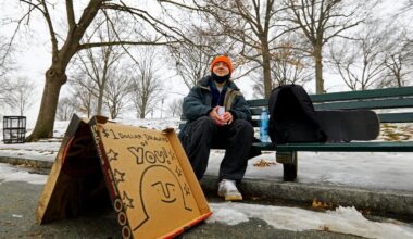 Artist Nick Shea sets up shop on a bench on the Boston Common on Feb. 7, 2022.
