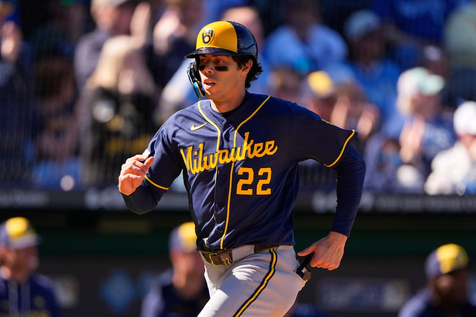 Milwaukee Brewers left fielder Christian Yelich runs home to score on a double by Jake Bauers...