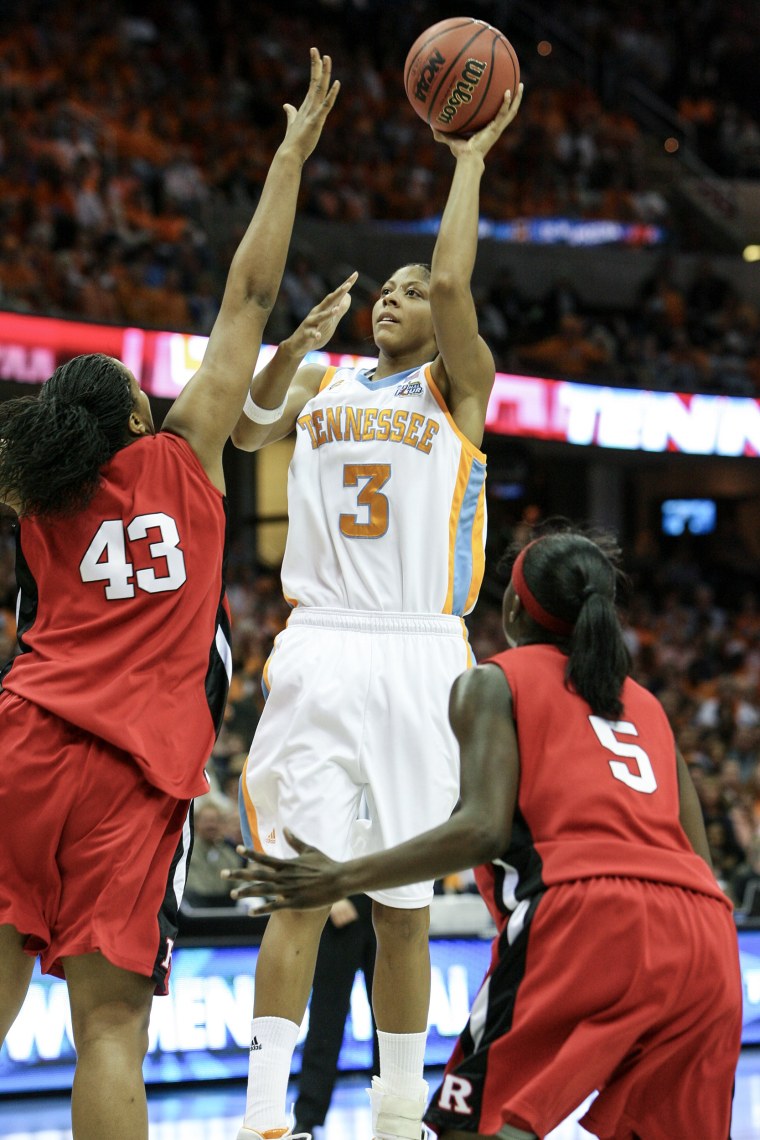 On-court action during an NCAA women's basketball game.