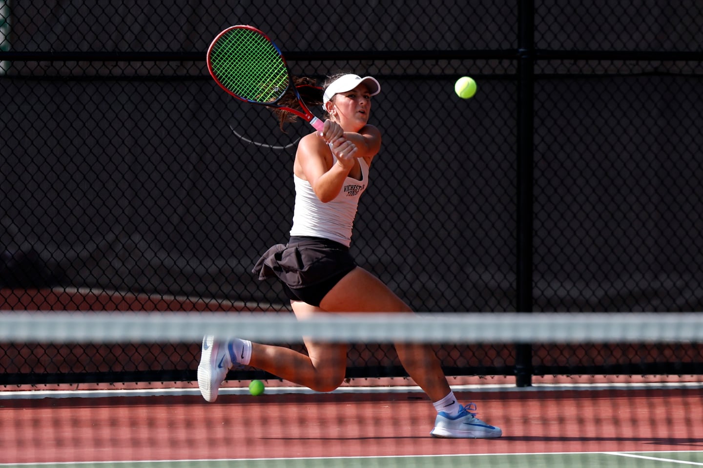 Lexington, MA- 6/12/25- Winchester’s Daryana Skobeleva hits to Wellesley’s Bella Gopen (not pictured) during a Division 1 girls’ tennis semifinal match on June 12, 2025, in Lexington. (Danielle Parhizkaran/Globe Staff)