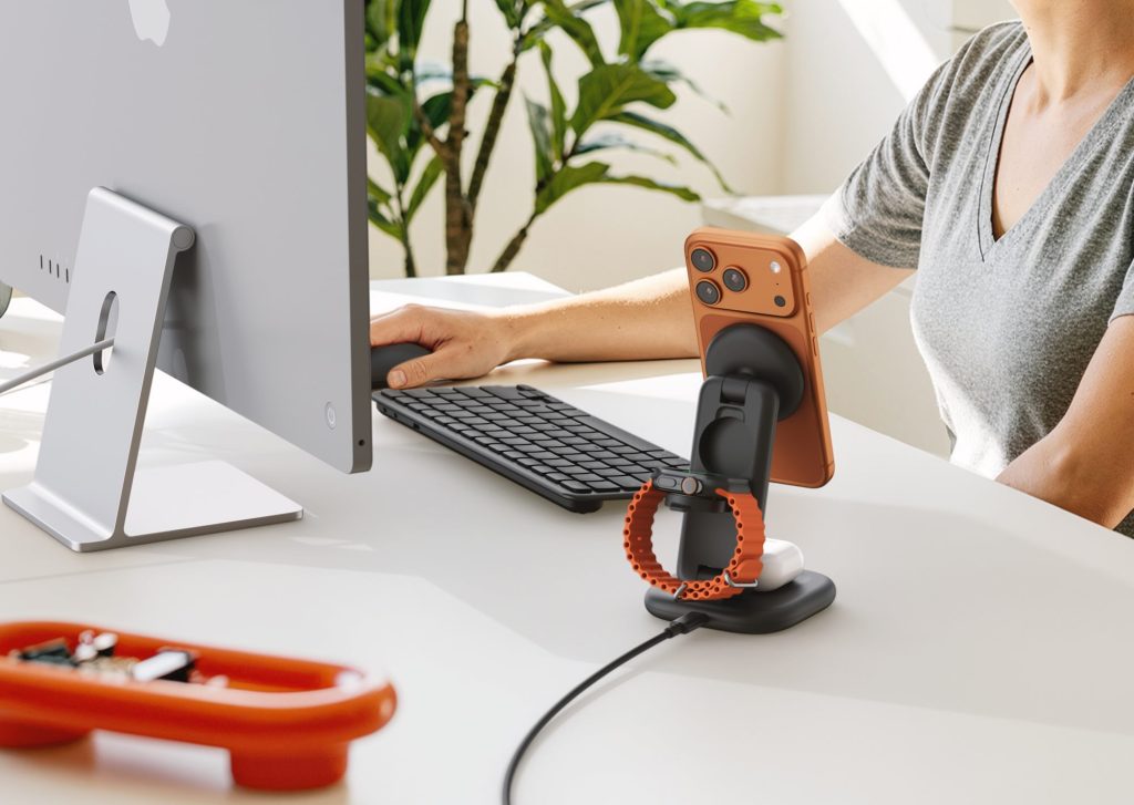 A person using a phone on a computer