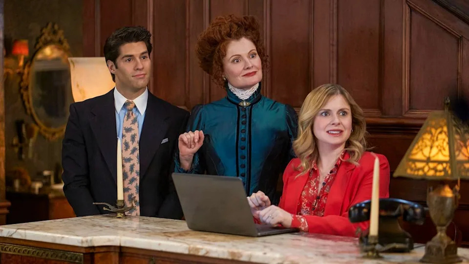 Trevor, Hetty, and Sam in the lobby of the bed and breakfast in Ghosts Season 3x10.