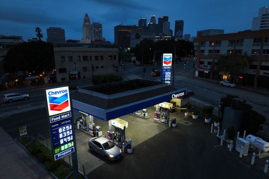 Gas prices are displayed at a Chevron gas station, in downtown Los Angeles.