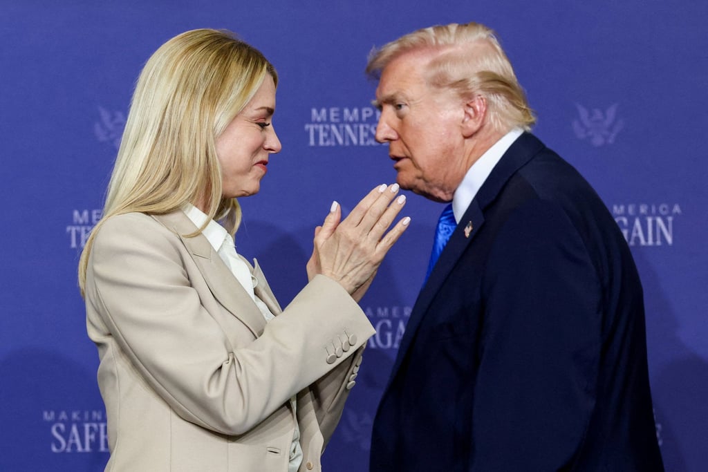 US Attorney General Pam Bondi applauds as US President Donald Trump walks past her at an event in Memphis, Tennessee, on Monday. Photo: Reuters
