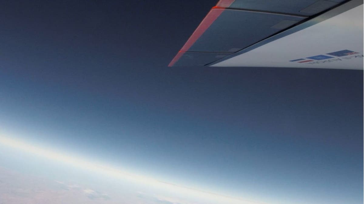 Uncrewed Mk-II rocket-powered spaceplane flying in the sky