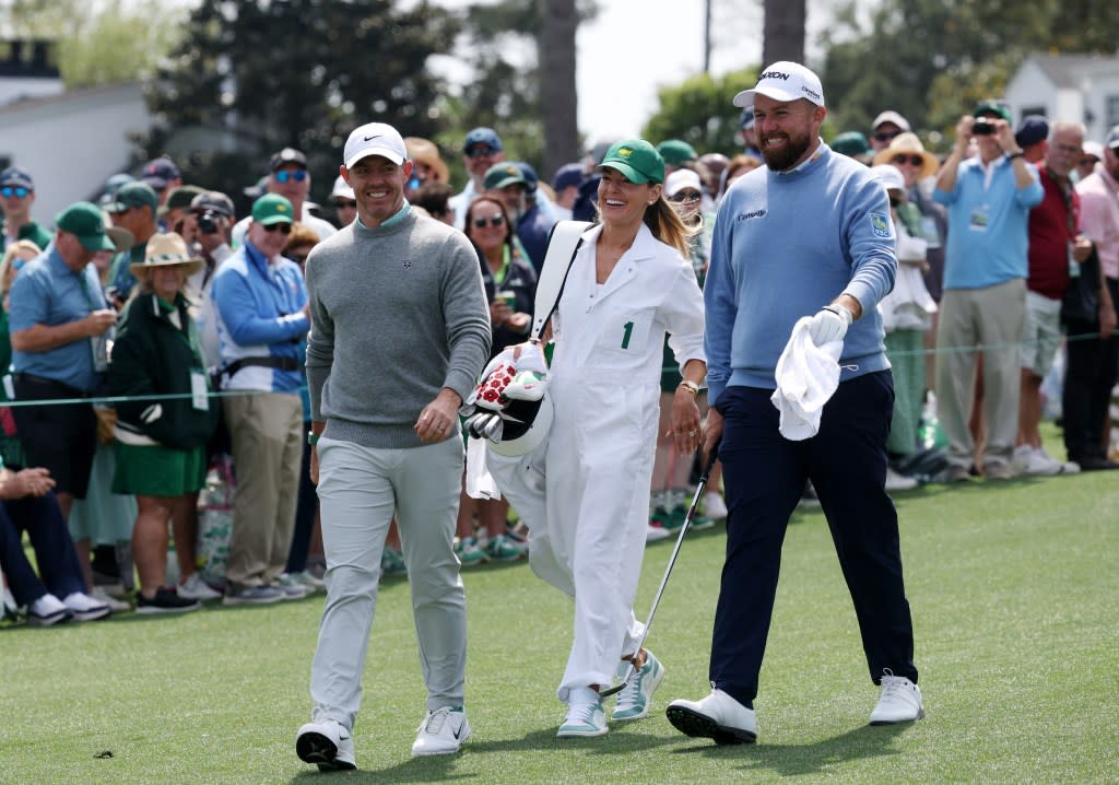 Northern Ireland’s Rory McIlroy with his wife Erica Stoll and Ireland’s Shane Lowry on the 1st hole during the par 3 contest. REUTERS
