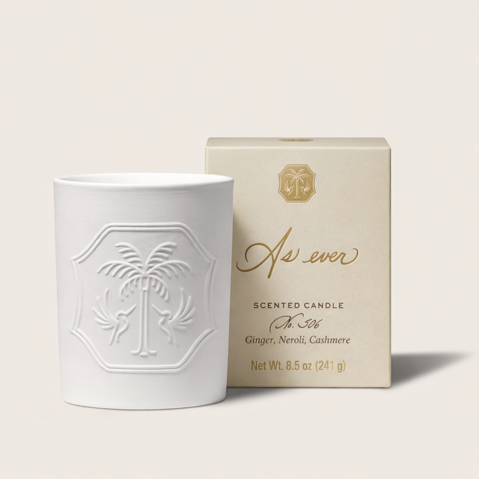 White scented candle and its packaging.