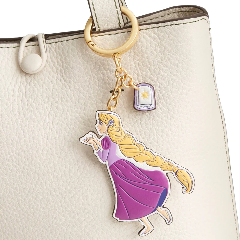 Rapunzel is the star of this hanging character charm. It shows the Tangled princess standing barefoot with her hands out in front of her. A second dangling charm shows a floating lantern.