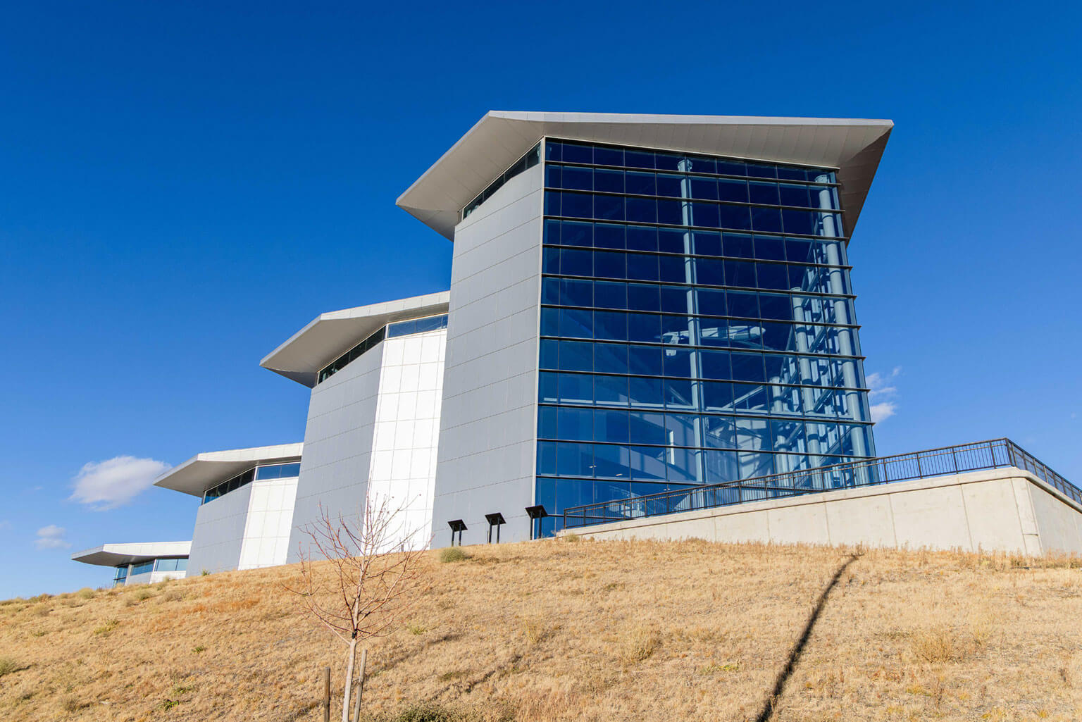 The U.S. Air Force Academy Hosmer Visitor Center located outside the Academy’s North Gate, Nov. 18, 2025. The Academy is relocating statues and memorials on the grounds surrounding the Hosmer Visitor Center to improve visibility for the public. (U.S. Air Force photo by Trevor Cokley)