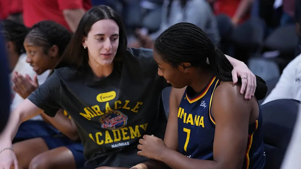 Indiana Fever guard Caitlin Clark (22) gives a hug to forward Aliyah Boston.Kirby Lee-Imagn Images