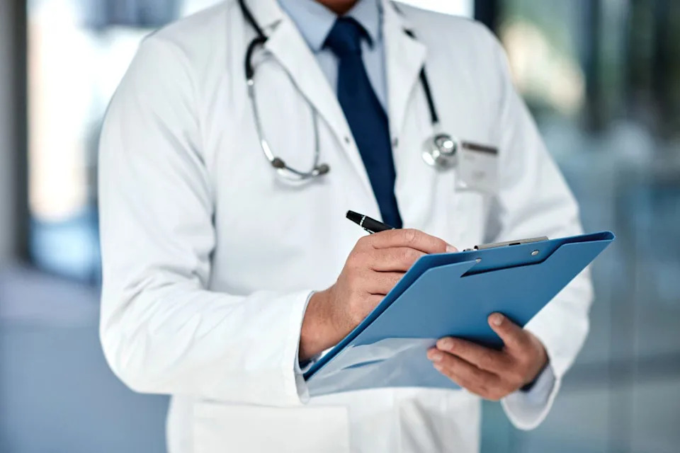 Stock image of a doctor writing notesCredit: Getty