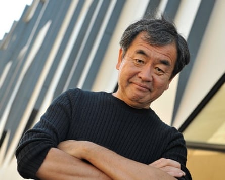 Kengo Kuma looking at the camera with his arms folded
