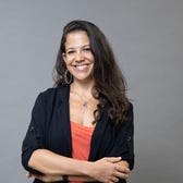 Alexandra Karplus standing with arms crossed.