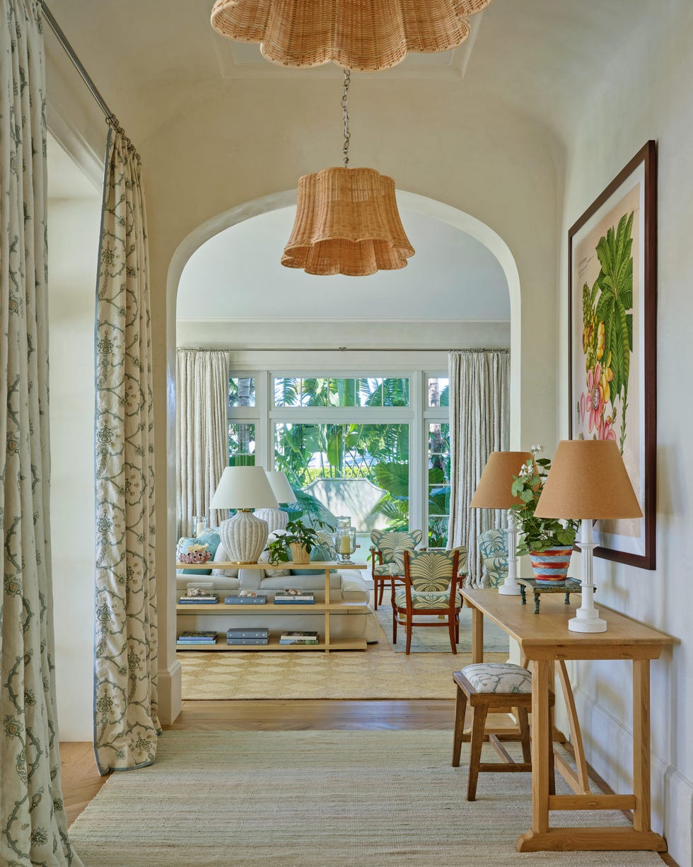Interior hallway leading to a brightly lit living area.