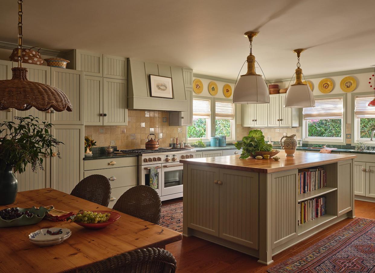 Bright, spacious kitchen featuring a central island and dining area.