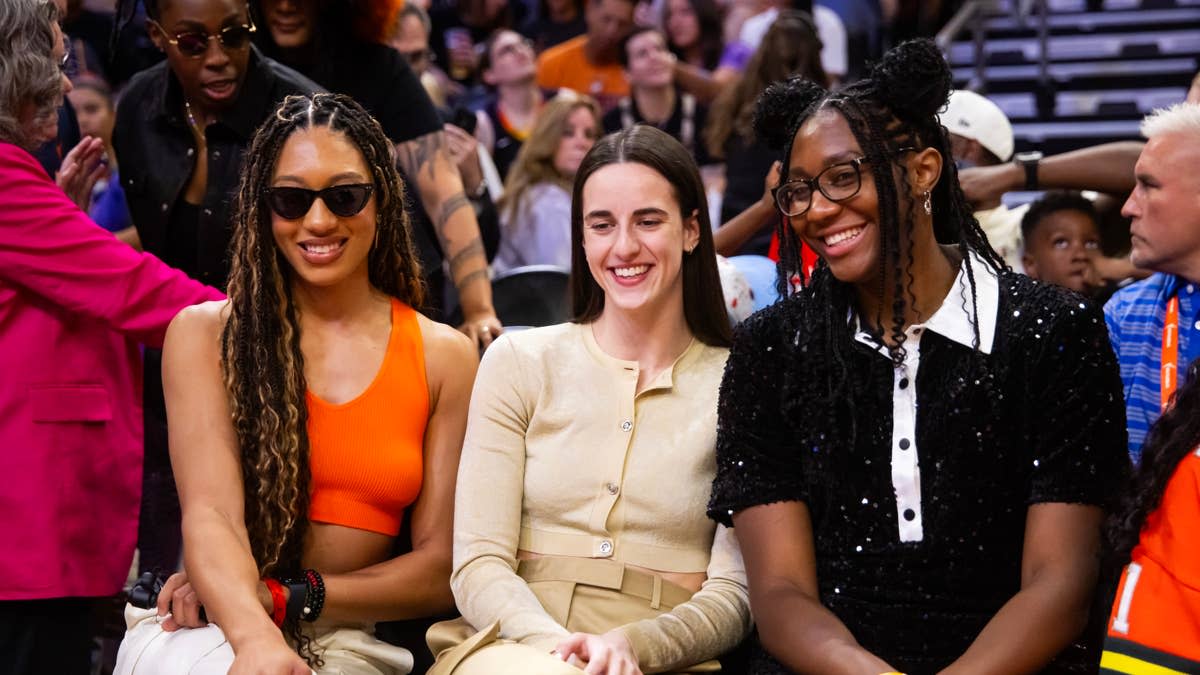 Indiana Fever players Aerial Powers, Caitlin Clark and Aliyah Boston look on from the sidelines during the WNBA All-Star Skills Night.© Mark J&period; Rebilas-Imagn Images