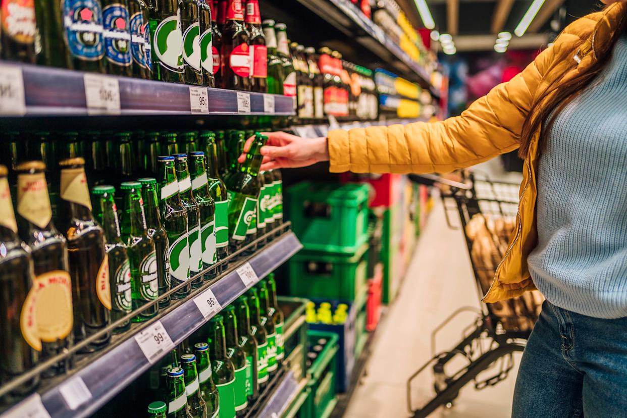 Customer buying beer in liquor store