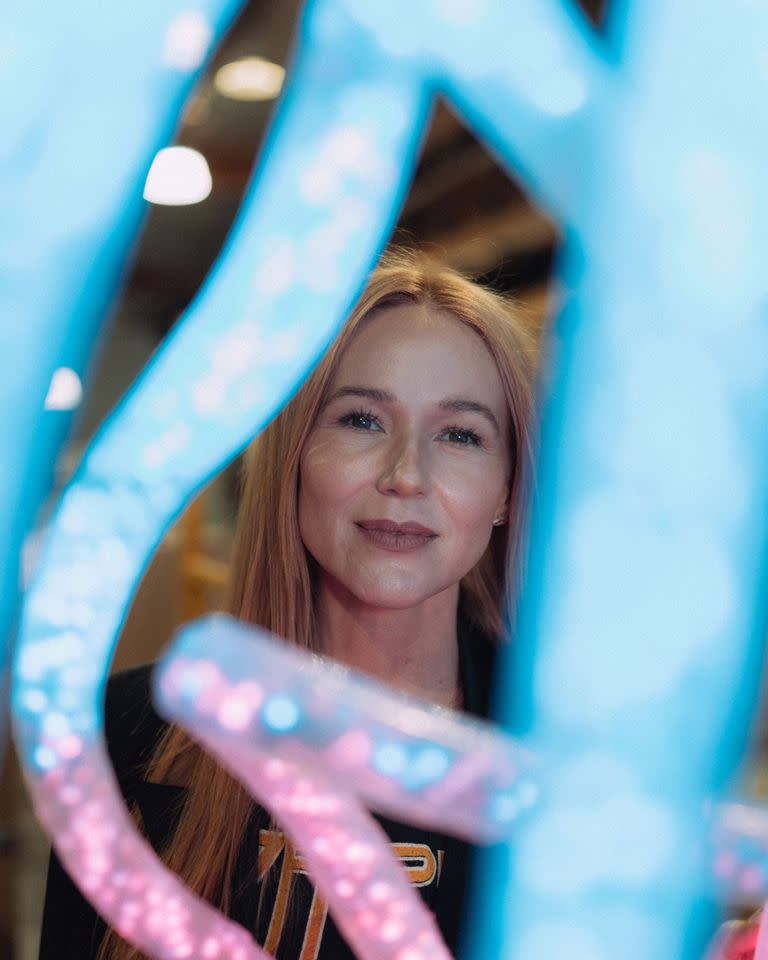 Jewel with one of her pieces from her upcoming art exhibit.Credit: Matthew Takes
