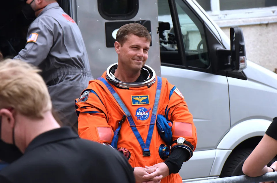 NASA astronaut Reid Wiseman greets friends and family after walking out of the Neil A. Armstrong Operations and Checkout Building before heading to pad 39B for the Artemis II launch aboard the Space Launch System (SLS) rocket at the Kennedy Space Center on April 1, 2026 in Cape Canaveral, Florida. Wiseman and NASA astronauts Victor Glover and Christina Koch, and Canadian Space Agency astronaut Jeremy Hansen will journey around the moon aboard the Orion spacecraft for more than nine days before splashing down in the Pacific.<p>&lpar;Photo by Paul Hennessy&sol;Anadolu via Getty Images&rpar;</p>
