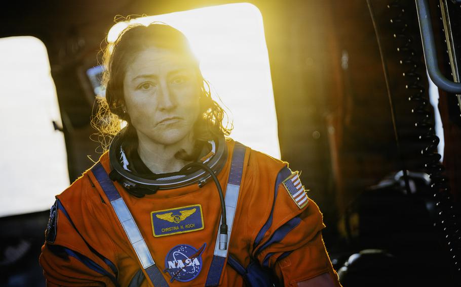 Christina Kock looks at the camera with the sun illuminating her face in the background.