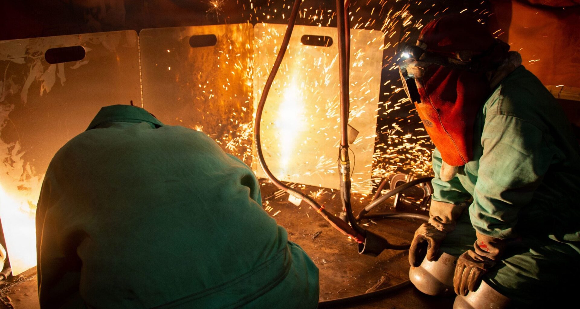 Nimitz-class aircraft carrier Ronald Reagan undergoing scheduled maintenance by shipyard welders