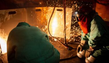Nimitz-class aircraft carrier Ronald Reagan undergoing scheduled maintenance by shipyard welders