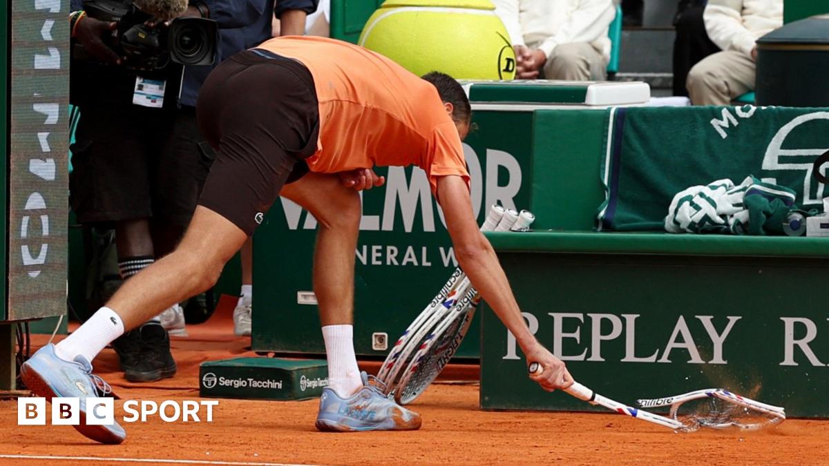 Daniil Medvedev smashes his racquet
