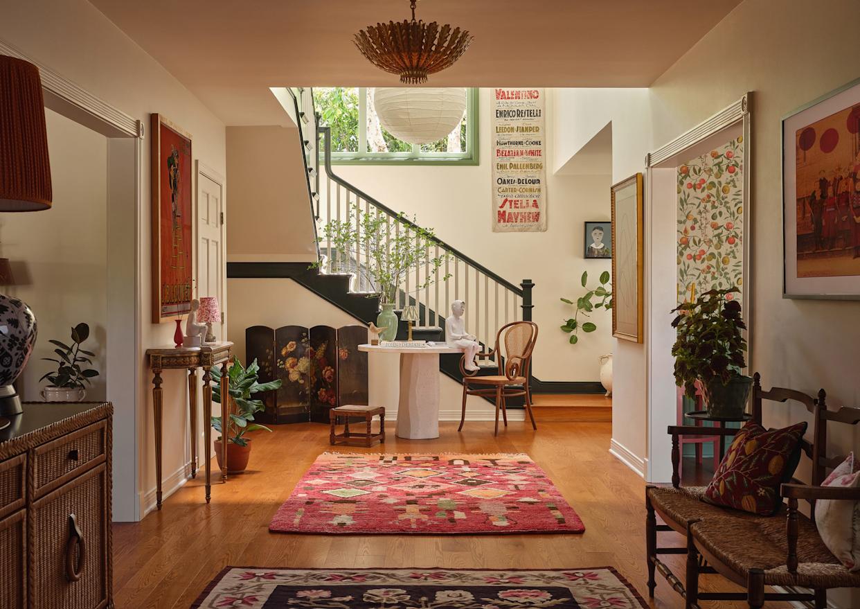 A welcoming foyer showcasing a blend of art and decor elements.