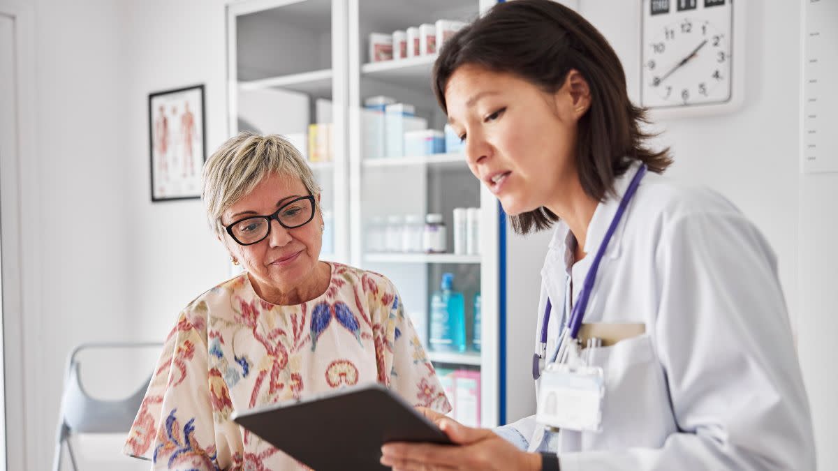 Doctor sharing medical results with woman