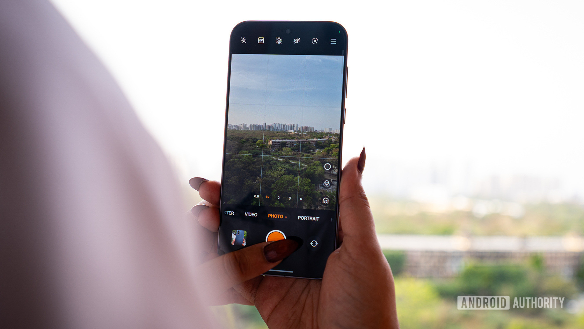 A person clicking a photo with the OPPO Find X9 Pro A person clicking a photo with the OPPO Find X9 Pro
