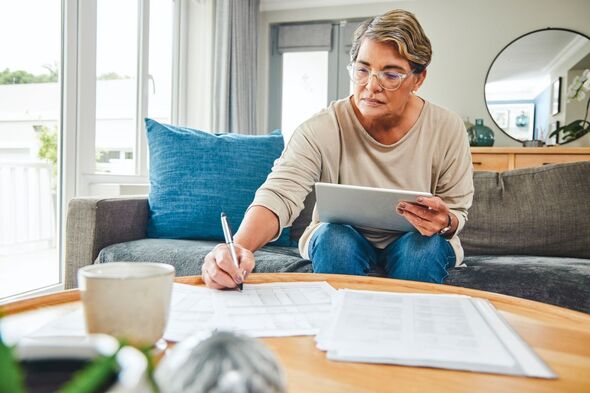 A woman looking at IHT forms A woman looking at IHT forms