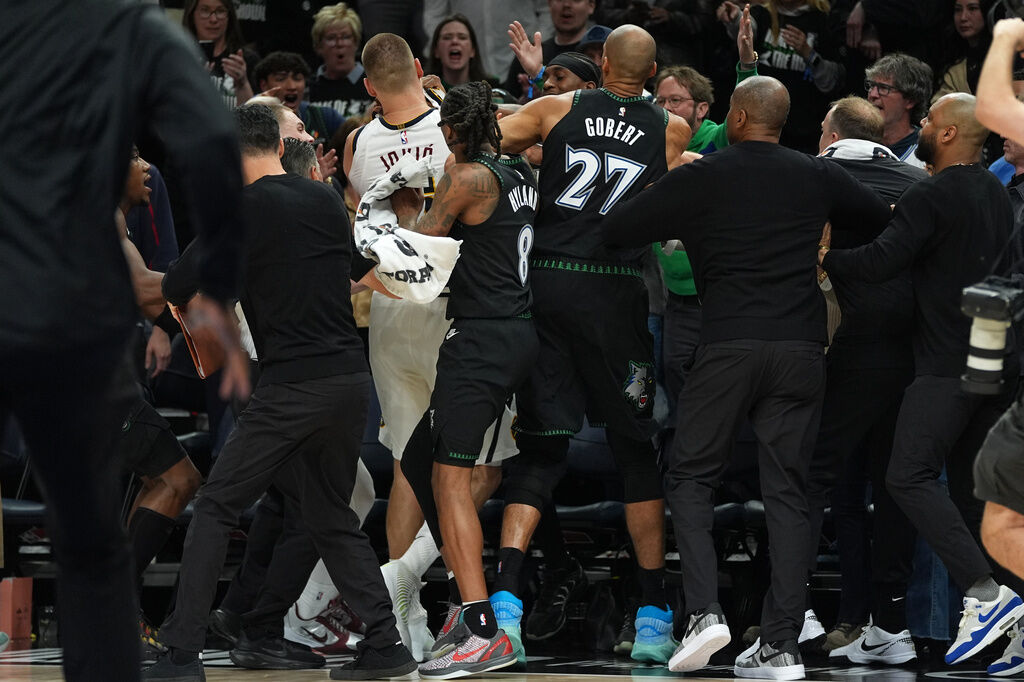 Minnesota Timberwolves and Denver Nuggets players get into an altercation during the second half of Game 4 of a first-round NBA basketball playoff series, Saturday, April 25, 2026, in Minneapolis. (AP Photo/Abbie Parr)