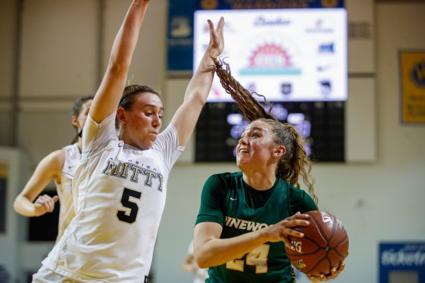 SANTA CRUZ, CALIFORNIA - FEBRUARY 25: Archbishop Mitty's Noemie Bariteau (5) blocks Pinewood High School's Elle Ladine (24) in the second quarter during the Central Coast Section Open Division championship at Kaiser Permanente Arena in Santa Cruz, Calif., on Saturday, Feb. 25, 2022. (Shae Hammond/Bay Area News Group)