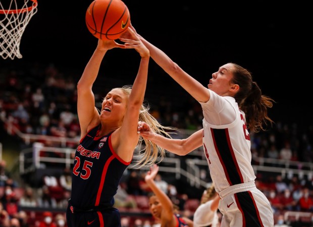 STANFORD, CALIFORNIA - JANUARY 30: Stanford Cardinal's Lacie Hull (24) fights for the ball against Arizona Wildcats' Cate Reese (25) in the fourth quarter at Maples Pavilion in Stanford, Calif., on Sunday, Jan. 30, 2022. (Nhat V. Meyer/Bay Area News Group)